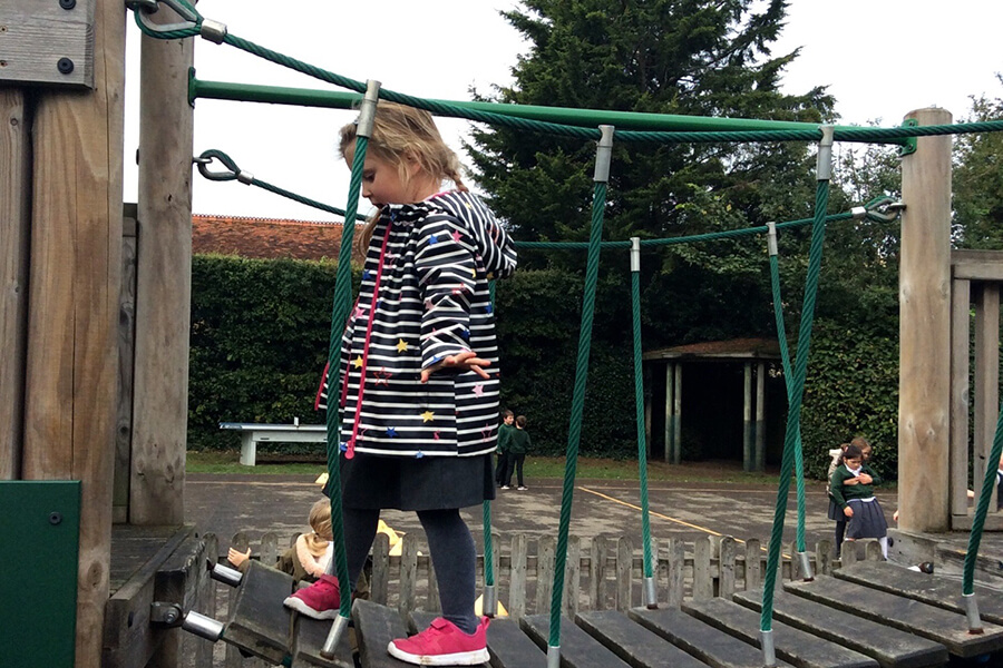 girl on climbing frame